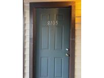 Condo front door painted blue with dark trim displaying unit number 8105 at 8105 Sheldon Shores Dr, Tampa, FL 33615
