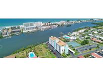 Beautiful aerial view of waterfront condo community featuring lush landscaping and community amenities at 10216 Regal Dr # 310, Largo, FL 33774