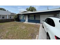 Charming single-story home with a well-maintained front yard and a private driveway at 1427 15Th S St, St Petersburg, FL 33705