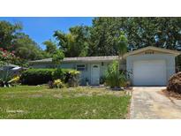 Charming single-story home with well-maintained landscaping and a one-car garage at 3026 19Th Sw Pl, Largo, FL 33774