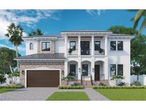 Stunning two-story home featuring a stone facade, covered entry, and upper level balconies, and an attached garage at 481 Bosphorous Ave, Tampa, FL 33606