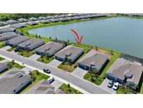 Beautiful single-Gathering homes feature lake views, well-manicured lawns and lush landscaping at 8589 Saint Kitts Cir, Englewood, FL 34224