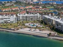 Beautiful aerial view of waterfront condos with a pool, beach, and Intracoastal Waterway views at 6021 Bahia Del Mar Cir # 239, St Petersburg, FL 33715