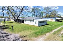 Charming exterior view of a cozy single-story house featuring a well-maintained lawn and a classic mailbox at 6673 146Th N Ave, Clearwater, FL 33764
