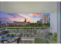 Relax on the balcony with seating and views of the city skyline at sunset at 700 Beach Ne Dr # 704, St Petersburg, FL 33701