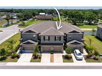Beautiful multi-Gathering home with attached garages and manicured landscaping at 937 Royal Empress Dr, Ruskin, FL 33570