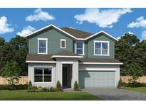 Charming two-story home features a modern design, attached two car garage, and lush landscaping at 10652 Crescent Creek Xing, Parrish, FL 34219