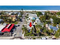 Aerial view of a charming neighborhood with beautiful beachfront access and palm tree-lined streets at 2100 Pass A Grille Way, St Pete Beach, FL 33706