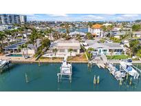 Stunning waterfront home with private dock and beautiful views of the bay, perfect for boaters at 5 Marina Ter, Treasure Island, FL 33706