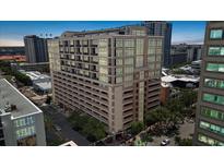 Modern building featuring large windows, architectural details, and a covered parking garage in a vibrant urban setting at 175 S 2Nd S St # Ph-16, St Petersburg, FL 33701