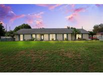 Charming single-story home with a well-manicured lawn and decorative shutters, perfect for comfortable living at 2013 Capri Rd, Valrico, FL 33594