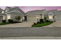Charming townhome featuring a well-manicured lawn and a two-car garage at 3520 51St W Ave, Bradenton, FL 34210