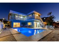 Inviting waterfront home featuring a private pool and multiple decks, perfect for enjoying outdoor living at 474 20Th Ave, Indian Rocks Beach, FL 33785