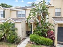 Inviting townhouse featuring well-maintained landscaping and a charming front entryway at 6249 Osprey Lake Cir, Riverview, FL 33578