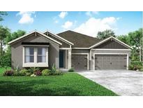 Charming single-story home with a two-car garage, landscaped yard, and a welcoming front entrance at 15725 Rosebud Ct, Punta Gorda, FL 33982