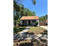 Charming single-story home with a cozy front porch and well-maintained lawn at 1675 13Th S Ave, St Petersburg, FL 33712