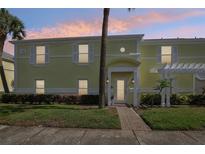 Charming condo featuring a private entrance, lush landscaping, and quaint architectural details at 219 Pompano Se Dr # C, St Petersburg, FL 33705