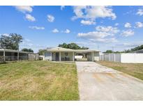 Charming single-story home with a carport and spacious front yard at 2830 Anthony St, Tampa, FL 33619