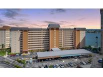 Multi-story condo building with assigned parking and water views showcases a coastal living experience at 5130 Brittany S Dr # 604, St Petersburg, FL 33715