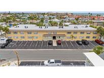 A well-maintained three-story condo building with ample parking in a coastal setting at 600 71St Ave # 18, St Pete Beach, FL 33706