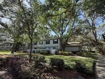 Charming townhome with mature trees and lush landscaping offers a serene view at 6206 Dewdrop Way # 0, Temple Terrace, FL 33617