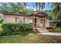 Charming single-story home with a inviting front porch and well-manicured lawn at 6406 Congress St, New Port Richey, FL 34653