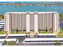Large condo complex with multiple floors, parking, and views of the bay at 7050 Sunset S Dr # 1401, South Pasadena, FL 33707