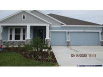 Charming single-story home with a two-car garage and well-maintained landscaping at 8916 Windlass Cv, Parrish, FL 34219