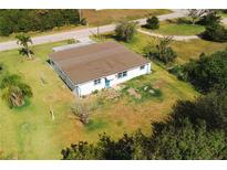 Aerial view of a single-story home with a spacious lawn at 3614 Vasco St, Punta Gorda, FL 33950