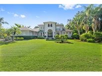 Beautiful two-story home featuring a well-manicured front yard and decorative shrubbery at 4512 Cheval Blvd, Lutz, FL 33558