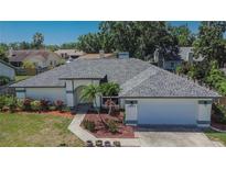 Charming single-story home featuring well-maintained landscaping and a welcoming two-car garage at 1801 Sagebrush Rd, Plant City, FL 33566