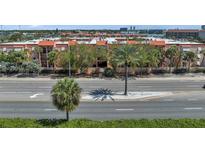 Charming condo building with palm trees, offering a serene street view at 8931 Blind Pass Rd # 360, St Pete Beach, FL 33706