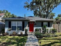Charming single-story home featuring a bright red front door and well-maintained landscaping at 2745 4Th S Ave, St Petersburg, FL 33712