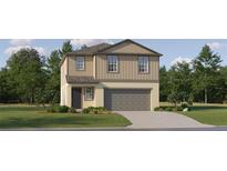 Two-story home with an attached garage, neutral color palette, and manicured front lawn at 2711 Bryce Ravine Ave, Plant City, FL 33563
