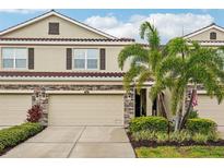 Charming townhome featuring a two-car garage and well-maintained landscaping at 601 52Nd Ter N, St Petersburg, FL 33703