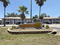 Sunridge Condominiums on Rocky Point Drive, featuring well-maintained landscaping and convenient parking at 5048 Sunridge Palms Dr # 103, Tampa, FL 33617