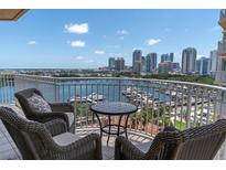 Enjoy breathtaking views from this condo's spacious balcony with comfortable seating overlooking the beautiful marina and city skyline at 555 5Th Ne Ave # 1032, St Petersburg, FL 33701