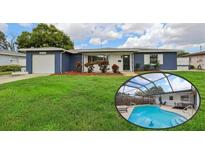 Charming single-story home features a covered pool area, a well-manicured lawn, and a one car garage at 6149 37Th N Ave, St Petersburg, FL 33710
