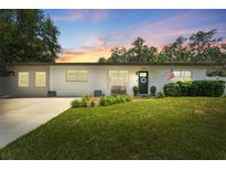 Charming single story home with well-manicured lawn and updated windows at 3418 W Bay Ave, Tampa, FL 33611