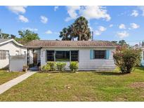 Charming single-story home with a well-maintained lawn and blue window trim at 4226 4Th S Ave, St Petersburg, FL 33711