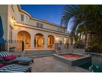 Inviting backyard with a pool and hot tub perfect for outdoor entertaining in a mediterranean-style villa at 514 Riviera Dr, Tampa, FL 33606