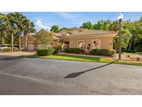 Beautifully landscaped exterior of home featuring lush greenery and mature trees at 7246 Gaberia Rd, New Port Richey, FL 34655