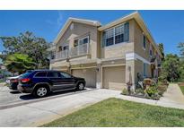 Charming townhouse with two-car garage and beautiful landscaping in a desirable neighborhood, perfect for comfortable living at 8447 Shallow Creek Ct, New Port Richey, FL 34653