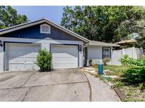 Charming single-Gathering home with a two-car garage and a well-maintained front yard at 2721 Baird Ct, Palm Harbor, FL 34684