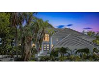 Stunning two-story home featuring an arched entry and lush tropical landscaping at 5212 62Nd S Ave, St Petersburg, FL 33715