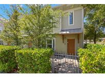 Charming two-story home with a well-maintained lawn and inviting front entrance at 1271 Drew St, Clearwater, FL 33755