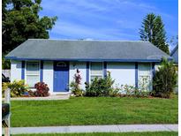 Charming single-story home with a well-manicured lawn and vibrant landscaping at 16011 Saddle Creek Dr, Tampa, FL 33618