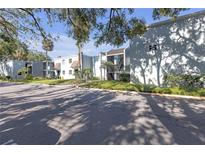 A well-maintained apartment complex with lush landscaping and sidewalks at 2820 Somerset Park Dr # 101, Tampa, FL 33613