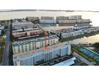 A beautiful aerial view of the condo and surrounding community that includes marina and ocean views at 2850 59Th S St # 310, Gulfport, FL 33707