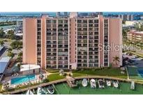 Condo building with pool and boat docks offers waterfront living and easy access to the bay at 51 Island Way # 309, Clearwater Beach, FL 33767